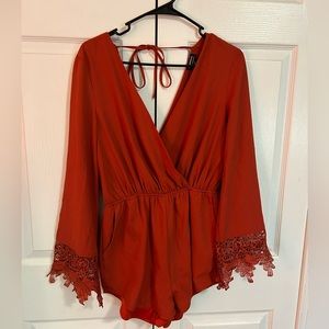 Long sleeve burnt orange romper (small)